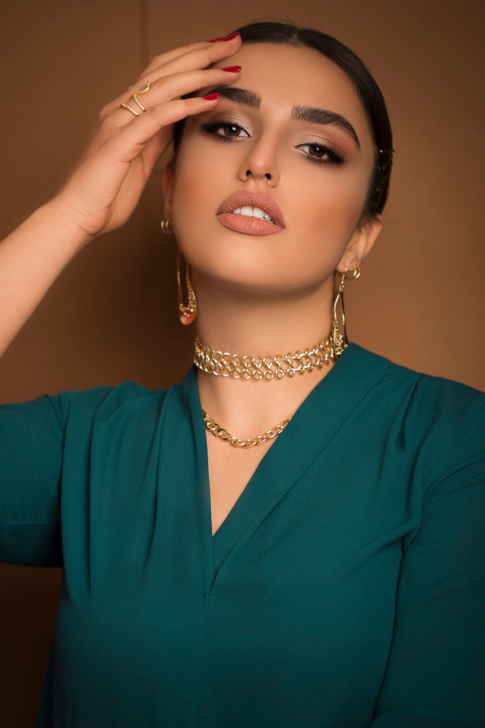 flamenco dancer model in blue outfit and dance updo romantic posing